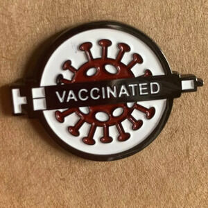 Brand new “vaccinated” enamel pin